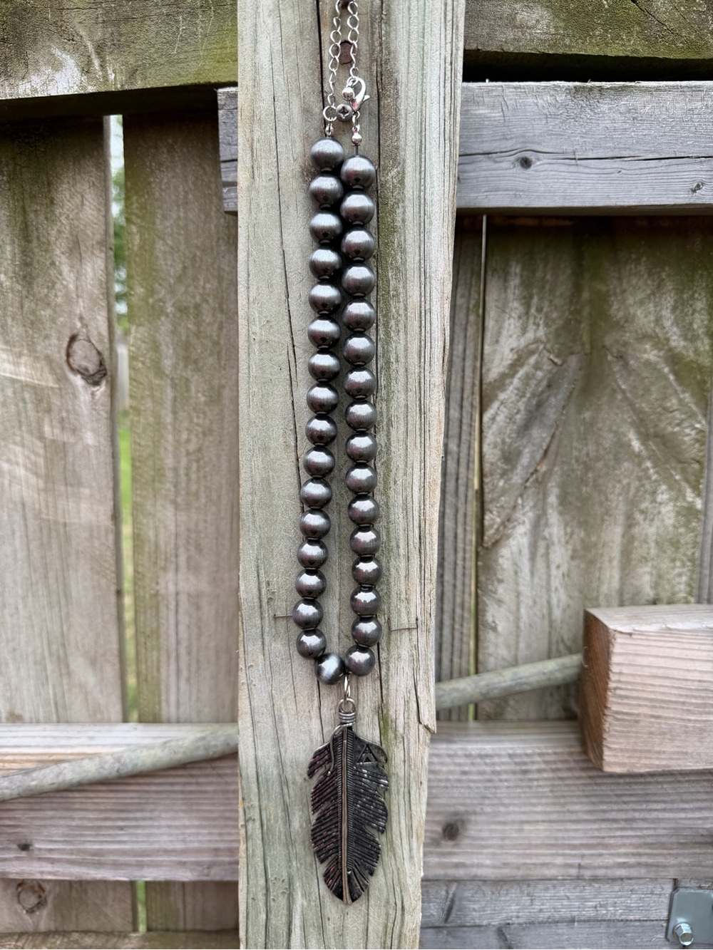 Bead Necklace with Feather Pendant